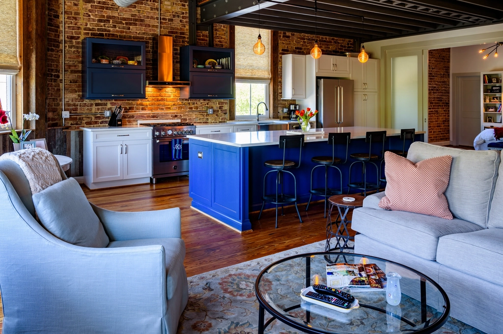 Kitchen with a painted blue island and bar seating