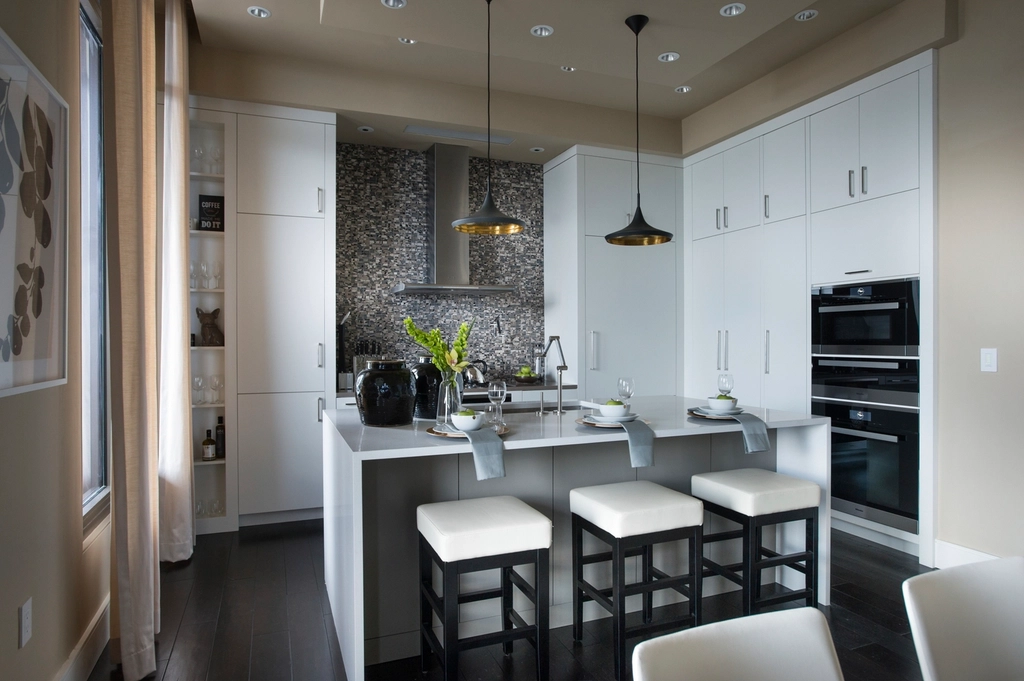 Clean modern white cabinetry with an island